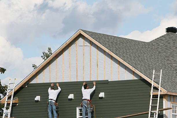 Professional Vinyl Siding technician working in Oakville, CT